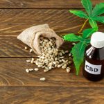 cannabis CBD oil hemp products – capsules and seeds of hemp.